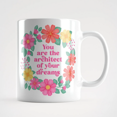 Motivational mug with quote: You are the architect of your dreams. Pink text with yellow, pink and orange floral wreath with green leaves and foliage.