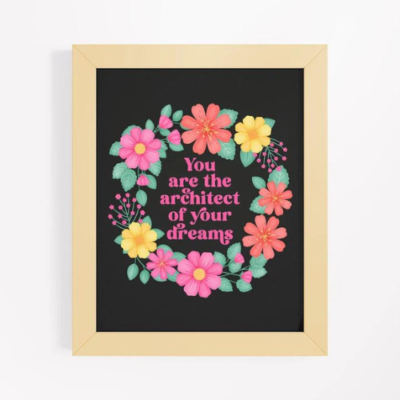 Motivational wall art with pink, orange and yellow floral wreath on black background with text: You are the architect of your dreams.