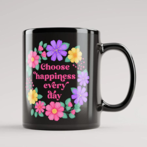 Black motivational mug with quote: Choose happiness every day. Pink text with purple, pink and yellow floral wreath with green leaves and foliage.