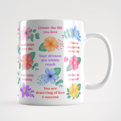 Motivational mug with inspirational quotes and vibrant flowers and foliage.