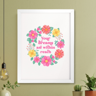 Motivational wall art with floral wreath reads: Your dreams are within reach.